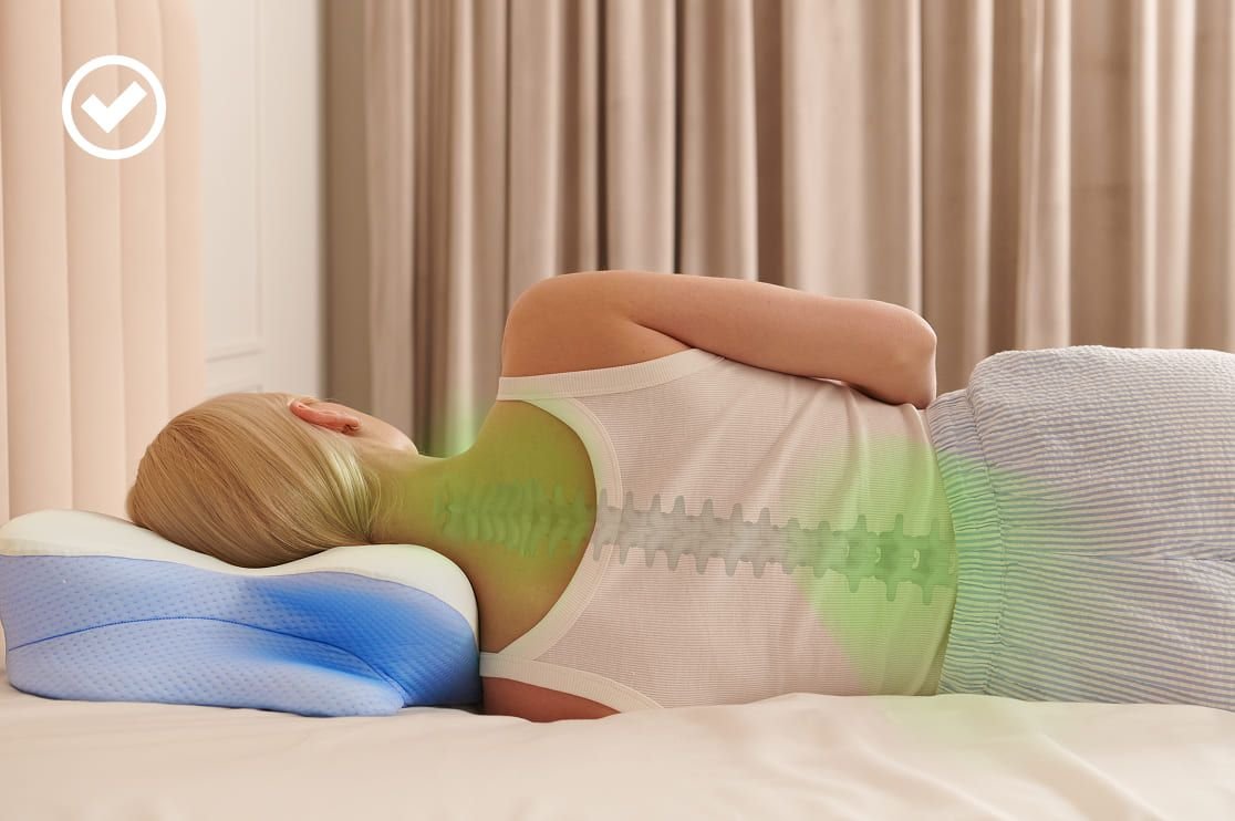 Woman sleeping on her side on a contoured pillow, with her spine highlighted in green to show correct alignment