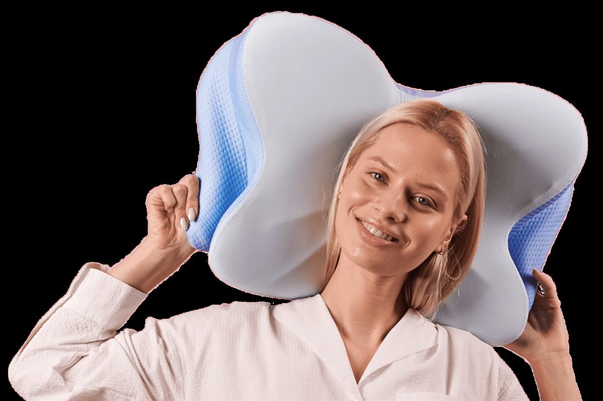 Woman holding the Derila Ergo contoured pillow